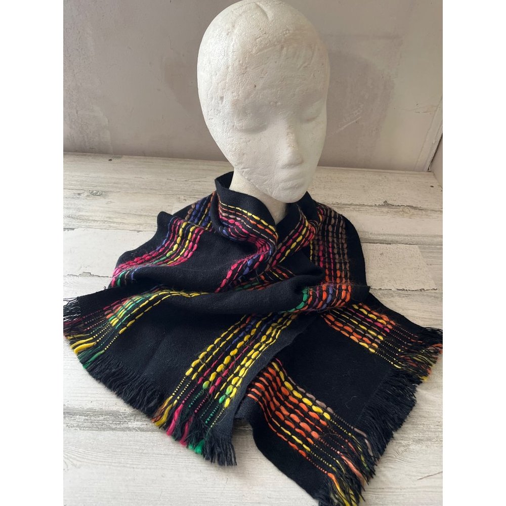 Woman’s black scarf with multi-colored thread stripes